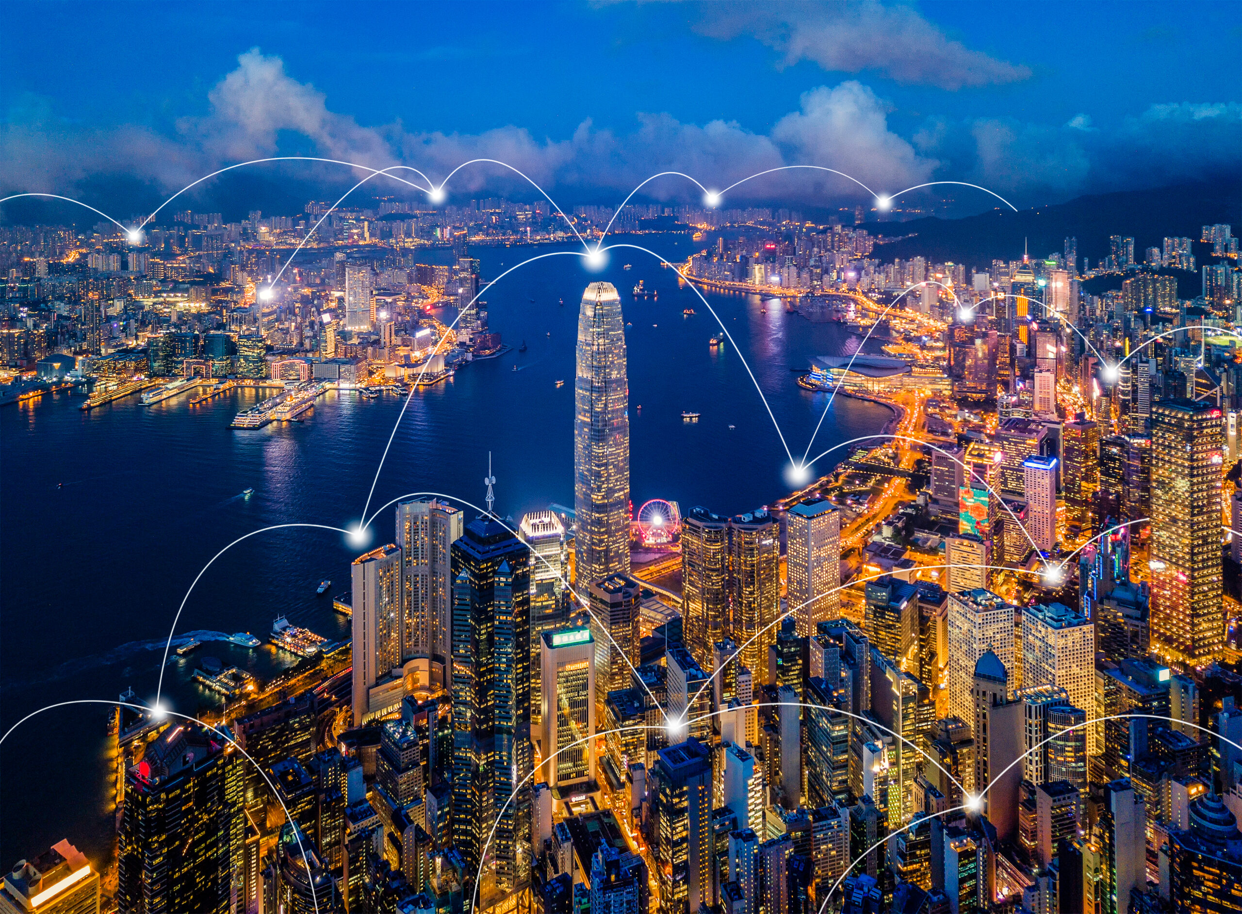 Digital network connection lines of Hong Kong Downtown. Financial district and business centers in smart city in technology concept. Skyscraper and high-rise buildings. Aerial view at night